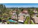 Scenic aerial view of a residential neighborhood showcasing lush landscaping and a backyard pool with city skyline views at 3361 Iberia St, Las Vegas, NV 89146