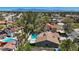 Expansive aerial view of a backyard with a swimming pool, mature trees, and a covered patio in a quiet neighborhood at 3361 Iberia St, Las Vegas, NV 89146