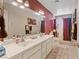 Bathroom features a double sink vanity and a shower-tub combo with colorful decor creating a functional and stylish space at 3361 Iberia St, Las Vegas, NV 89146