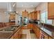Modern kitchen features stainless steel appliances, granite countertops, and an island cooktop at 3361 Iberia St, Las Vegas, NV 89146