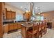 Spacious kitchen features a large island with seating and granite countertops at 3361 Iberia St, Las Vegas, NV 89146