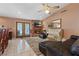 Spacious living room features brick fireplace, plush seating, and tile floors at 3361 Iberia St, Las Vegas, NV 89146