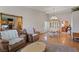 Open floor plan with hardwood floors, formal dining, and a view into the Gathering room at 3361 Iberia St, Las Vegas, NV 89146