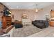 Cozy living room features brick fireplace, plush seating, and neutral color palette at 3361 Iberia St, Las Vegas, NV 89146