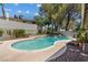 Serene backyard pool surrounded by mature landscaping creates a private and relaxing outdoor retreat at 3361 Iberia St, Las Vegas, NV 89146