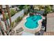 Backyard pool with lush green landscaping offers a private and refreshing outdoor escape at 3361 Iberia St, Las Vegas, NV 89146