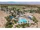 Stunning aerial view of the community clubhouse, pool, and amenities with golf course backdrop at 40 Stonemark Dr, Henderson, NV 89052