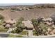 Aerial view of the property showcasing its lush landscaping, desert surroundings, and neighborhood at 40 Stonemark Dr, Henderson, NV 89052
