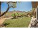 Expansive backyard with artificial grass, waterfall feature, and hilltop views at 40 Stonemark Dr, Henderson, NV 89052