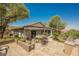 Outdoor patio with seating, lush landscaping, and built-in BBQ at 40 Stonemark Dr, Henderson, NV 89052