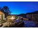 Backyard patio with a fire pit, built-in grill, and stunning city views, ideal for outdoor living at 40 Stonemark Dr, Henderson, NV 89052