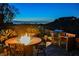 Scenic backyard with a fire pit, built-in grill, and picturesque city views, designed for outdoor enjoyment at 40 Stonemark Dr, Henderson, NV 89052
