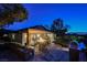 Inviting backyard patio featuring a fire pit, outdoor grill, and manicured landscaping, perfect for relaxation at 40 Stonemark Dr, Henderson, NV 89052