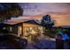 Cozy backyard patio with a fire pit, grill, and beautiful sunset views, ideal for outdoor gatherings at 40 Stonemark Dr, Henderson, NV 89052