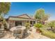 Outdoor patio with seating, lush landscaping, and built-in BBQ at 40 Stonemark Dr, Henderson, NV 89052