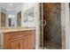 Bathroom showcasing a vanity with marble countertop and glass-enclosed shower at 40 Stonemark Dr, Henderson, NV 89052