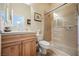 Bathroom featuring a tile countertop, wooden cabinets, and glass shower doors at 40 Stonemark Dr, Henderson, NV 89052