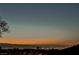 Panoramic city view at sunset, showcasing the lights of the cityscape nestled against the horizon at 40 Stonemark Dr, Henderson, NV 89052