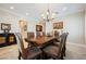 Formal dining room with chandelier and comfortable seating at 40 Stonemark Dr, Henderson, NV 89052