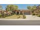Charming single-story home features well-manicured lawn and two-car garage at 40 Stonemark Dr, Henderson, NV 89052