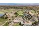 Expansive aerial view showcasing the golf course, ponds, clubhouse, and neighborhood at 40 Stonemark Dr, Henderson, NV 89052