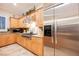 Gourmet kitchen featuring stainless steel appliances, granite countertops, and designer hood at 40 Stonemark Dr, Henderson, NV 89052