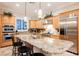 Spacious kitchen featuring granite countertops, stainless steel appliances, and custom cabinetry at 40 Stonemark Dr, Henderson, NV 89052