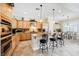 Kitchen featuring wooden cabinets, a large island, and stainless steel appliances at 40 Stonemark Dr, Henderson, NV 89052