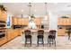 Gourmet kitchen features an island, stainless appliances, and ample cabinets at 40 Stonemark Dr, Henderson, NV 89052