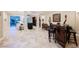 Open-concept living room boasts tile floors, bar, and outdoor access at 40 Stonemark Dr, Henderson, NV 89052