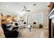 Open floor plan living room featuring a fireplace and sliding glass doors at 40 Stonemark Dr, Henderson, NV 89052