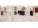 Stylish living area with tiled floors, custom bar, and elegant decor at 40 Stonemark Dr, Henderson, NV 89052