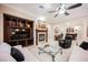 Bright living room featuring a fireplace with a built-in entertainment center and plush seating at 40 Stonemark Dr, Henderson, NV 89052