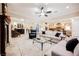 Open-concept living room showcasing tile flooring, recessed lighting, and a seamless flow to the kitchen at 40 Stonemark Dr, Henderson, NV 89052