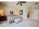 Spacious main bedroom with carpeted floors and view to ensuite at 40 Stonemark Dr, Henderson, NV 89052
