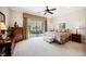Main bedroom with sliding glass doors to patio and neutral decor at 40 Stonemark Dr, Henderson, NV 89052