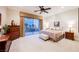 Relaxing main bedroom with patio access and elegant furnishings at 40 Stonemark Dr, Henderson, NV 89052
