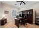 Home office featuring wood desk, custom cabinetry, and natural light at 40 Stonemark Dr, Henderson, NV 89052