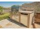 Built-in stainless steel BBQ and beverage refrigerator on patio at 40 Stonemark Dr, Henderson, NV 89052