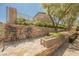 Outdoor patio with built-in BBQ and peaceful desert views at 40 Stonemark Dr, Henderson, NV 89052