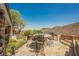 Outdoor patio with comfortable seating, built-in grill, and beautiful desert views at 40 Stonemark Dr, Henderson, NV 89052