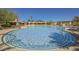 Large swimming pool with blue and white patterned tile edges and plenty of space for swimming laps at 40 Stonemark Dr, Henderson, NV 89052