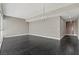 Large empty living room showcases sleek hardwood floors, modern lighting, and expansive windows at 4575 Dean Martin Dr # 1208, Las Vegas, NV 89103