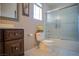 Bathroom showcasing a glass-enclosed shower, toilet, vanity and mirror at 4945 Volcanic Rock Ln, Las Vegas, NV 89122