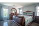 Primary bedroom with dark hardwood floors and coordinated wooden furniture set at 4945 Volcanic Rock Ln, Las Vegas, NV 89122