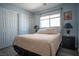 Bedroom with neutral walls, plush bedding, and convenient closet space at 4945 Volcanic Rock Ln, Las Vegas, NV 89122