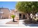 Charming two-story home with a well-manicured lawn and a cozy front porch area at 4945 Volcanic Rock Ln, Las Vegas, NV 89122