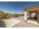Backyard features covered patio, desert landscaping, view fencing, and beautiful views of the mountains at 5341 E La Campana Dr, Pahrump, NV 89061