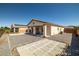 Home with a large backyard featuring desert landscaping, mountain views, and a covered patio at 5341 E La Campana Dr, Pahrump, NV 89061