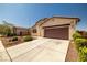 Wide driveway leading to a well-maintained home with desert landscaping and ample parking space at 5341 E La Campana Dr, Pahrump, NV 89061